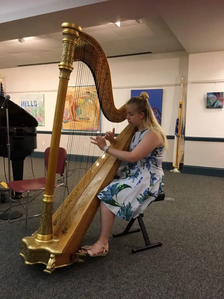 Harp student performing at Allegro Music School
