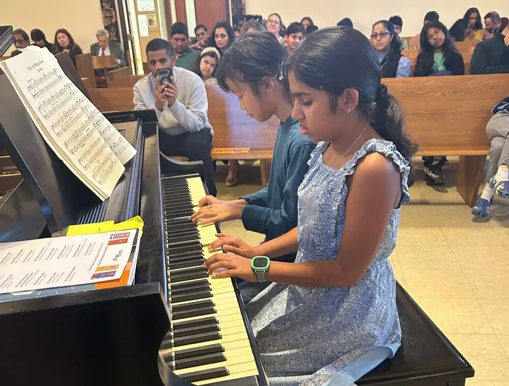 A harmonious duet fills the room with music and celebration.